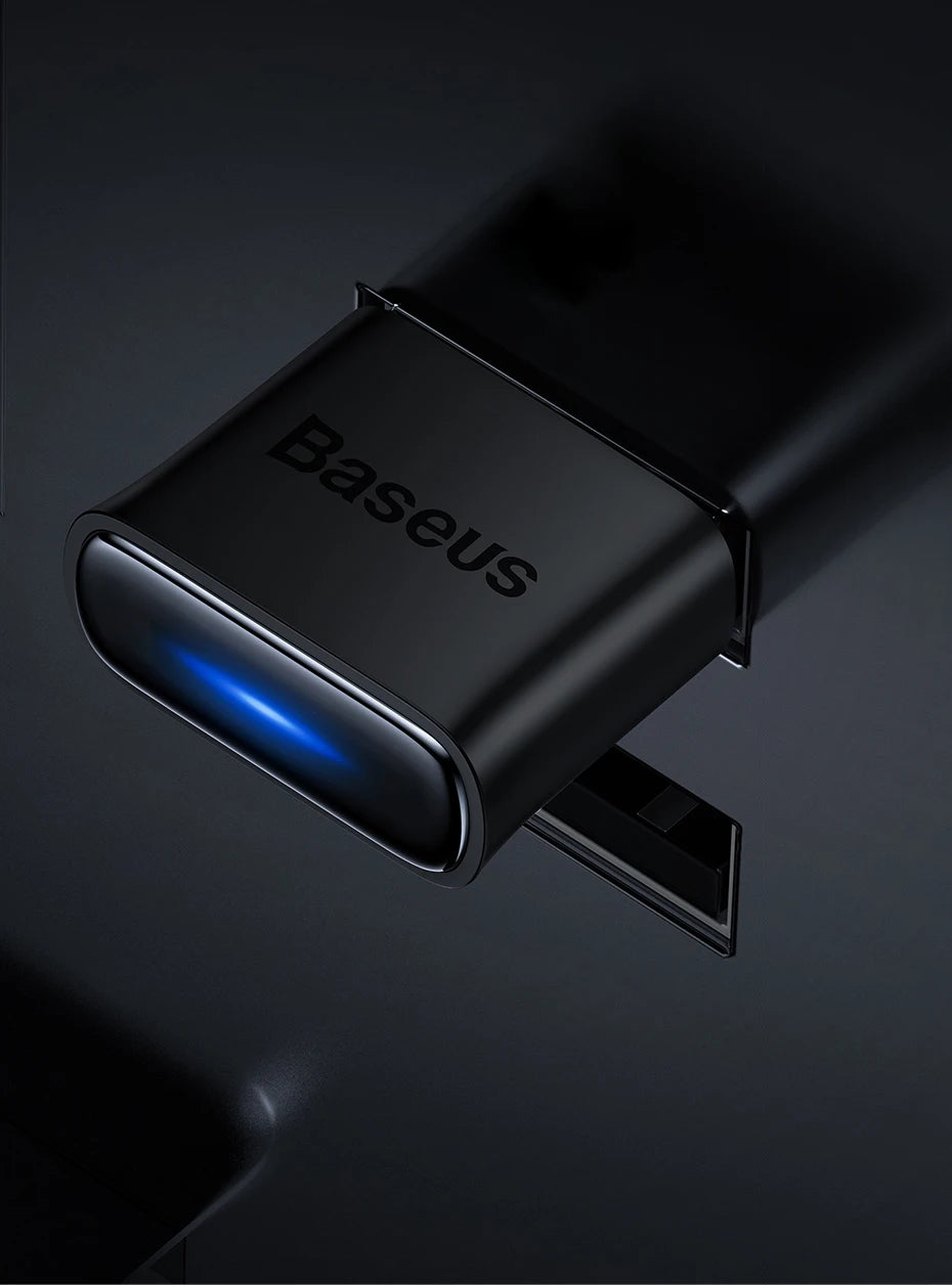Close-up of Baseus Bluetooth adapter with blue indicator light
