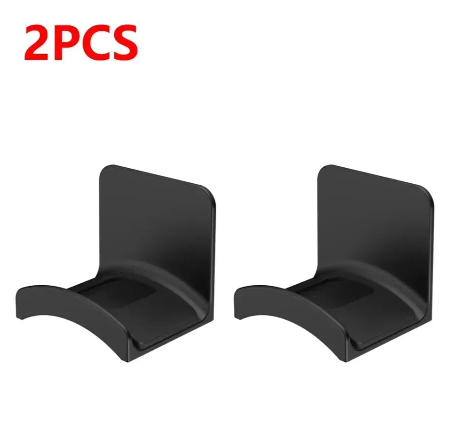 Two black HookDock adhesive headphone hooks