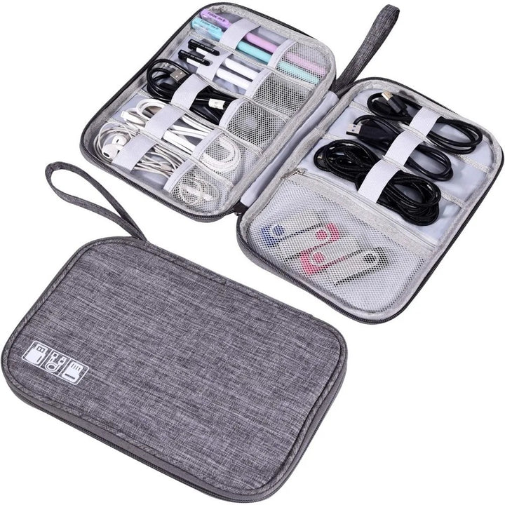 Gray travel cable organizer bag open with elastic loops and mesh pockets on a white background