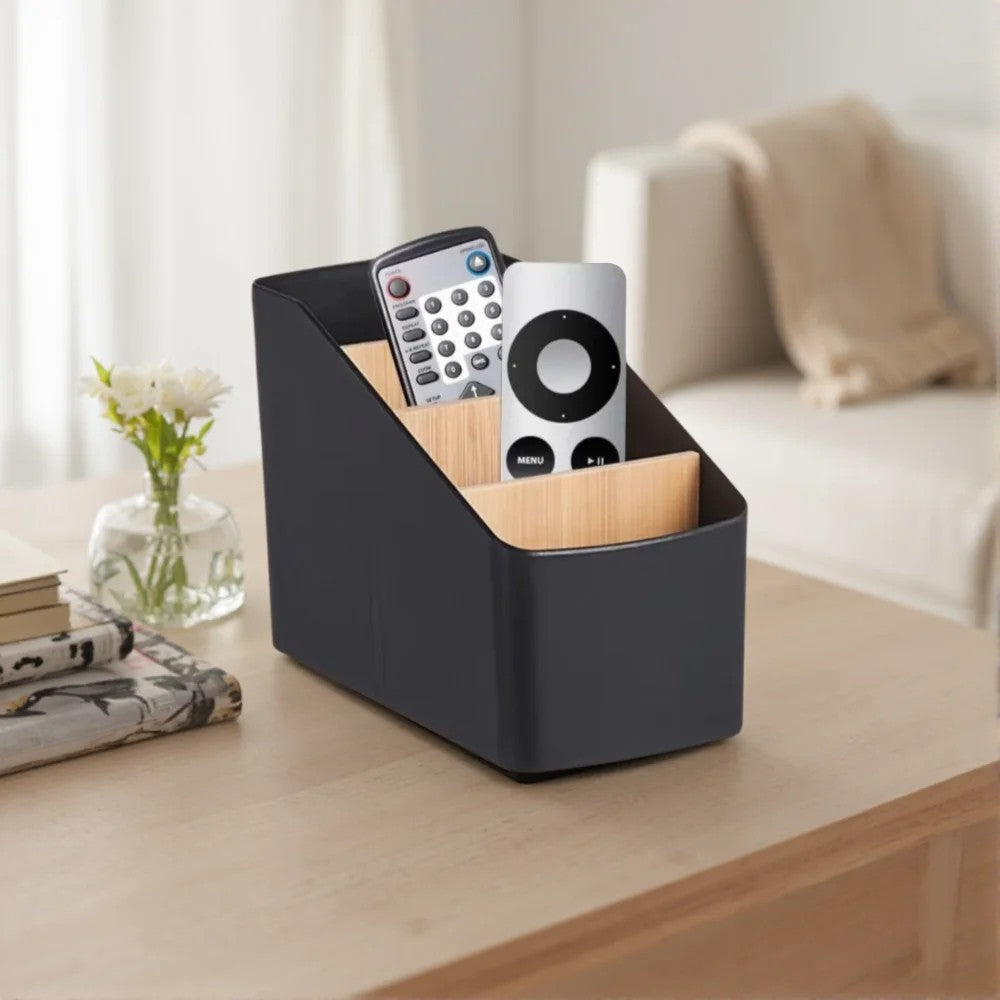 RemoteNest black desktop remote organizer on a living room table