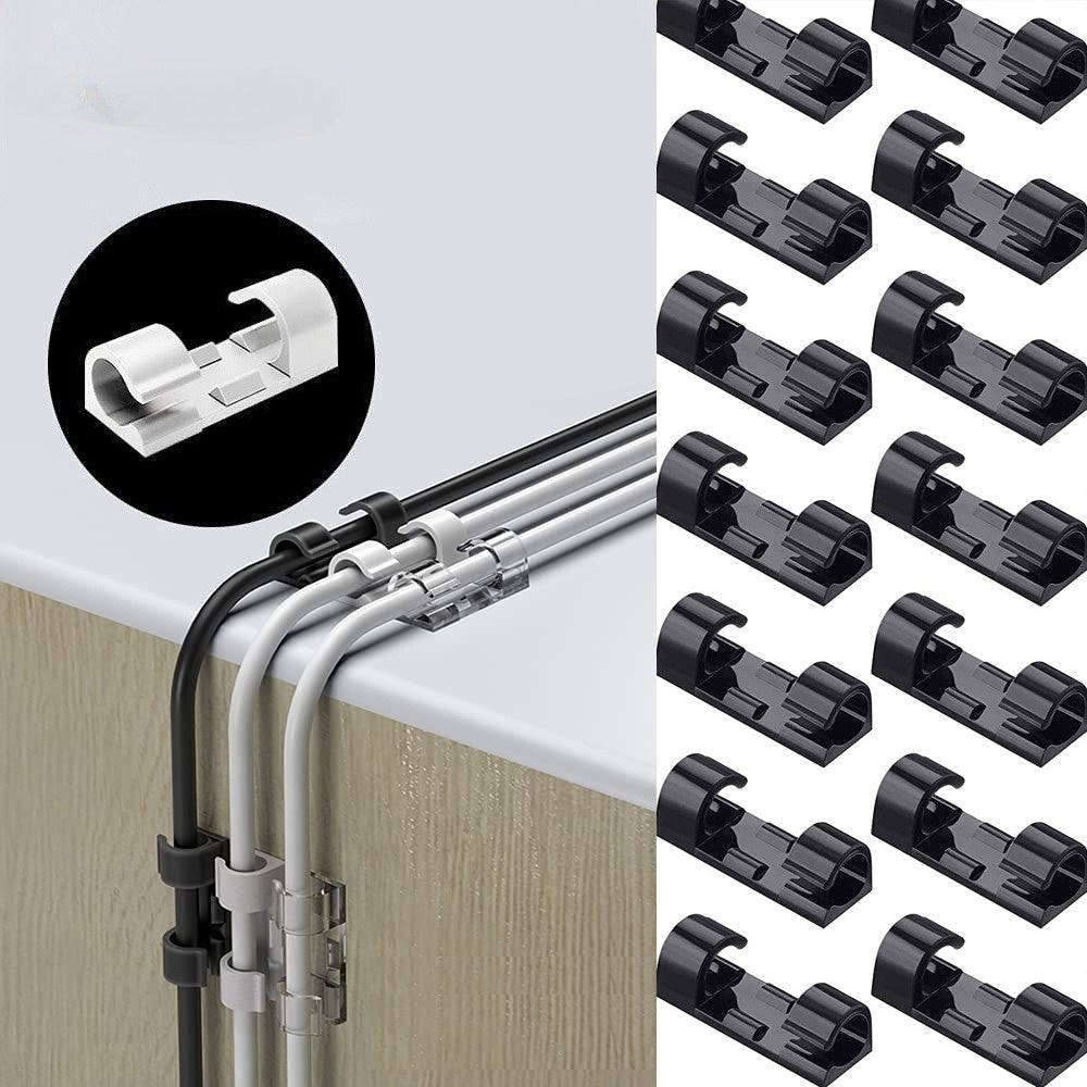Transparent adhesive cable clips organizing cables on a desk edge