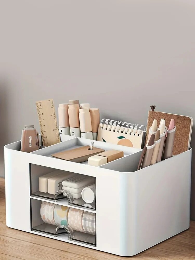 Two-drawer white desk organizer holding pens notes and small accessories