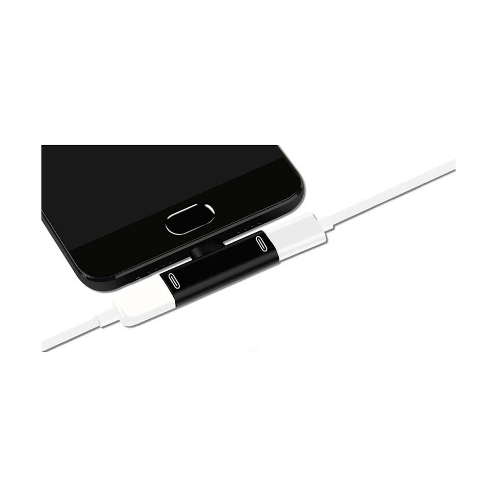 DuoSplit USB-C male to dual USB-C female splitter connected to a phone