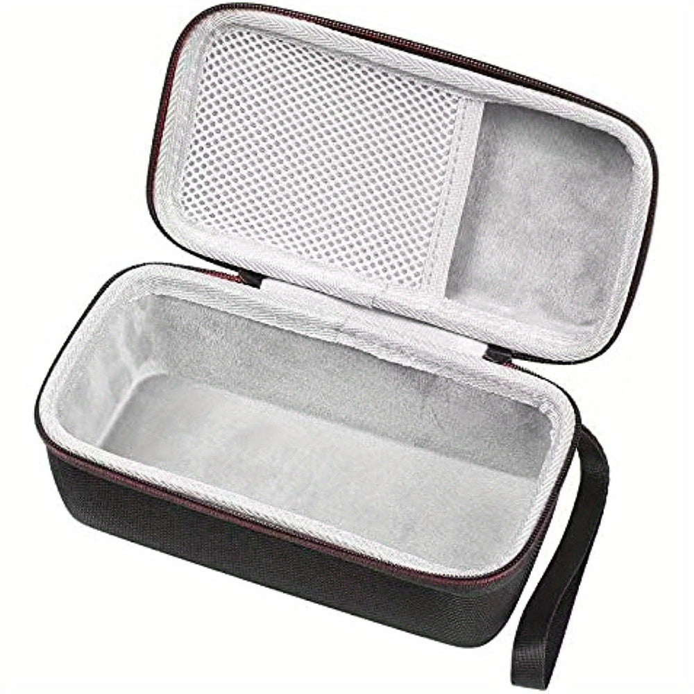 Open hard shell tech accessory storage case with mesh pocket on a white background