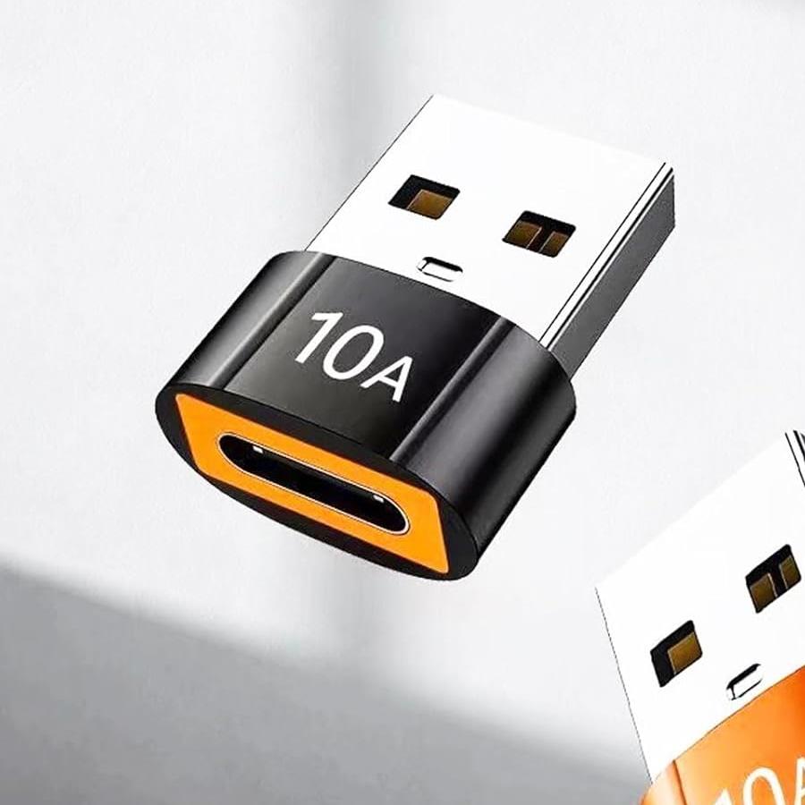 Orange USB-A to USB-C mini adapter on a light background