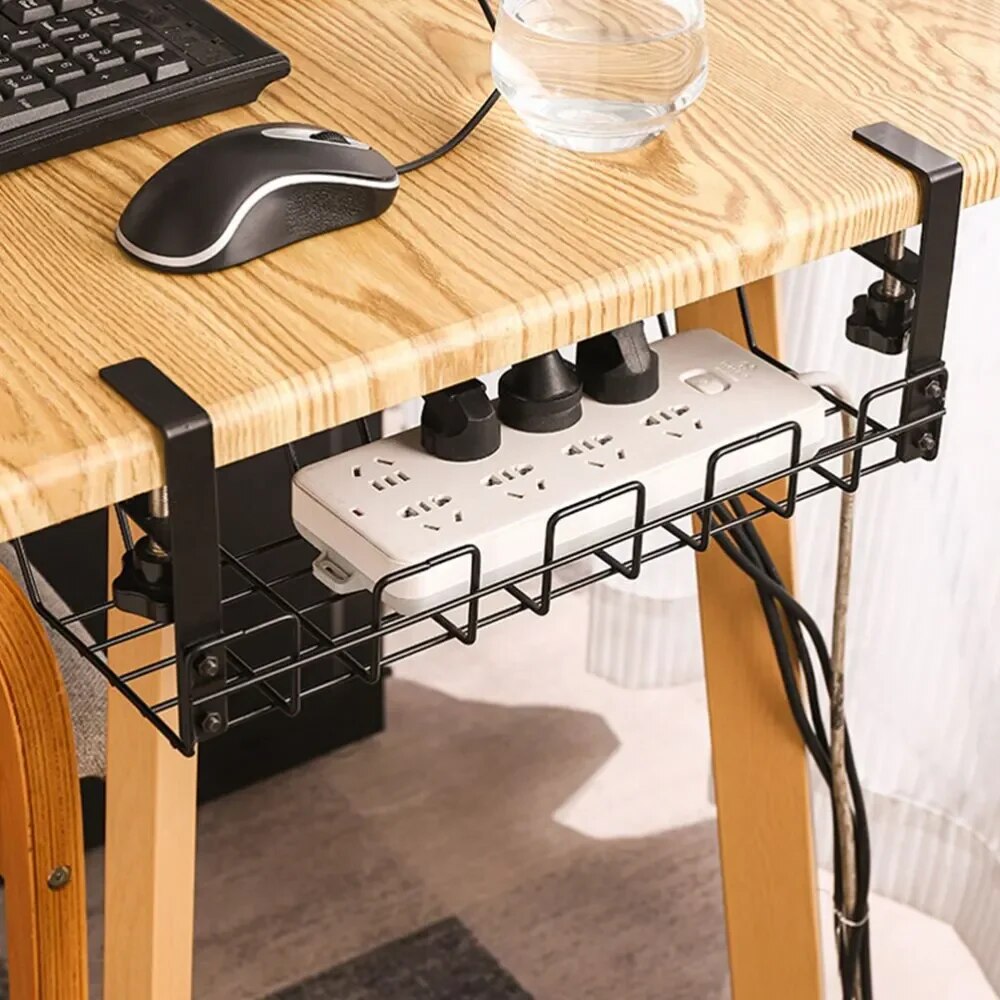 Black under-desk cable management tray installed below a desk